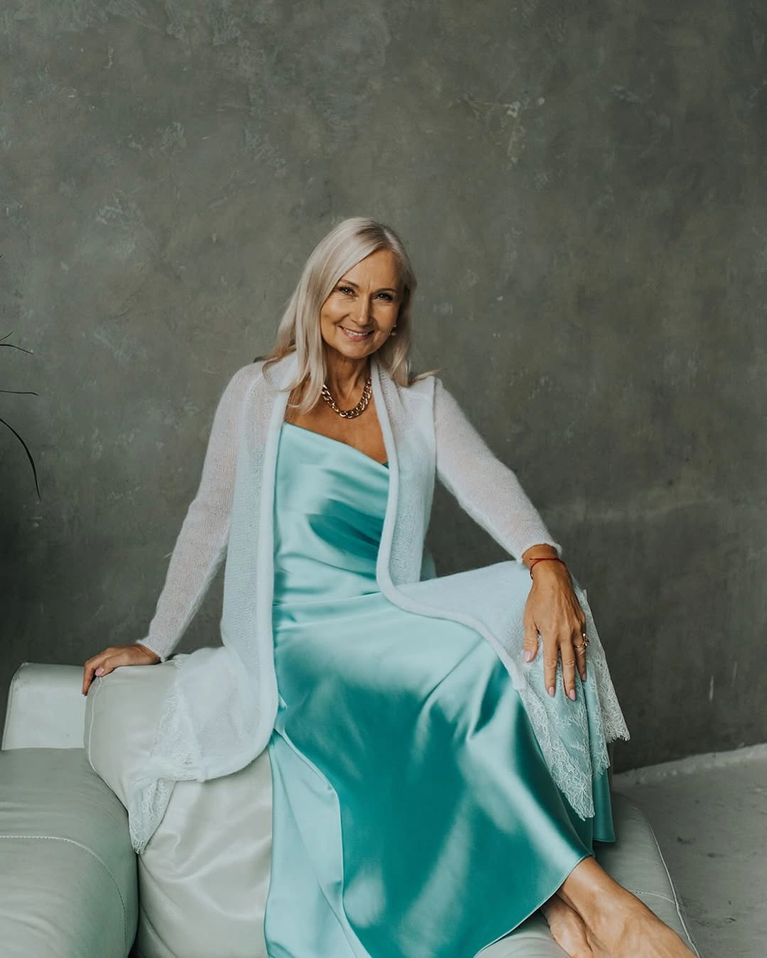 Aqua dress with white open layer and necklace