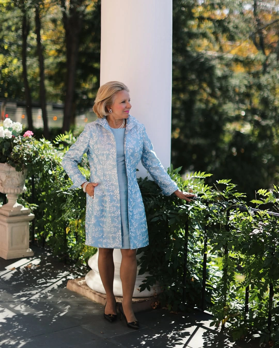 Light blue patterned coat over matching blue layer