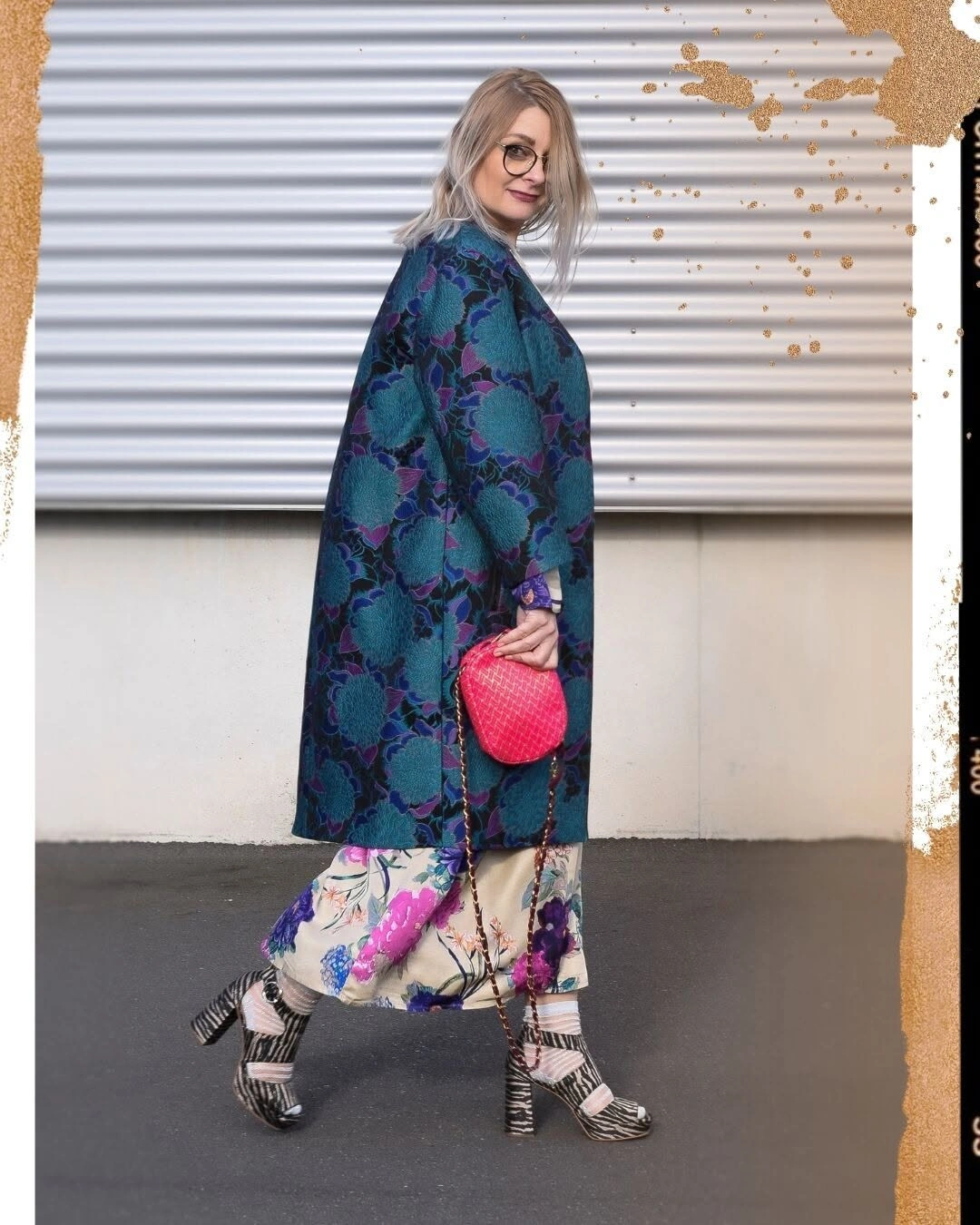 Teal floral coat with pale floral lower layer and pink bag