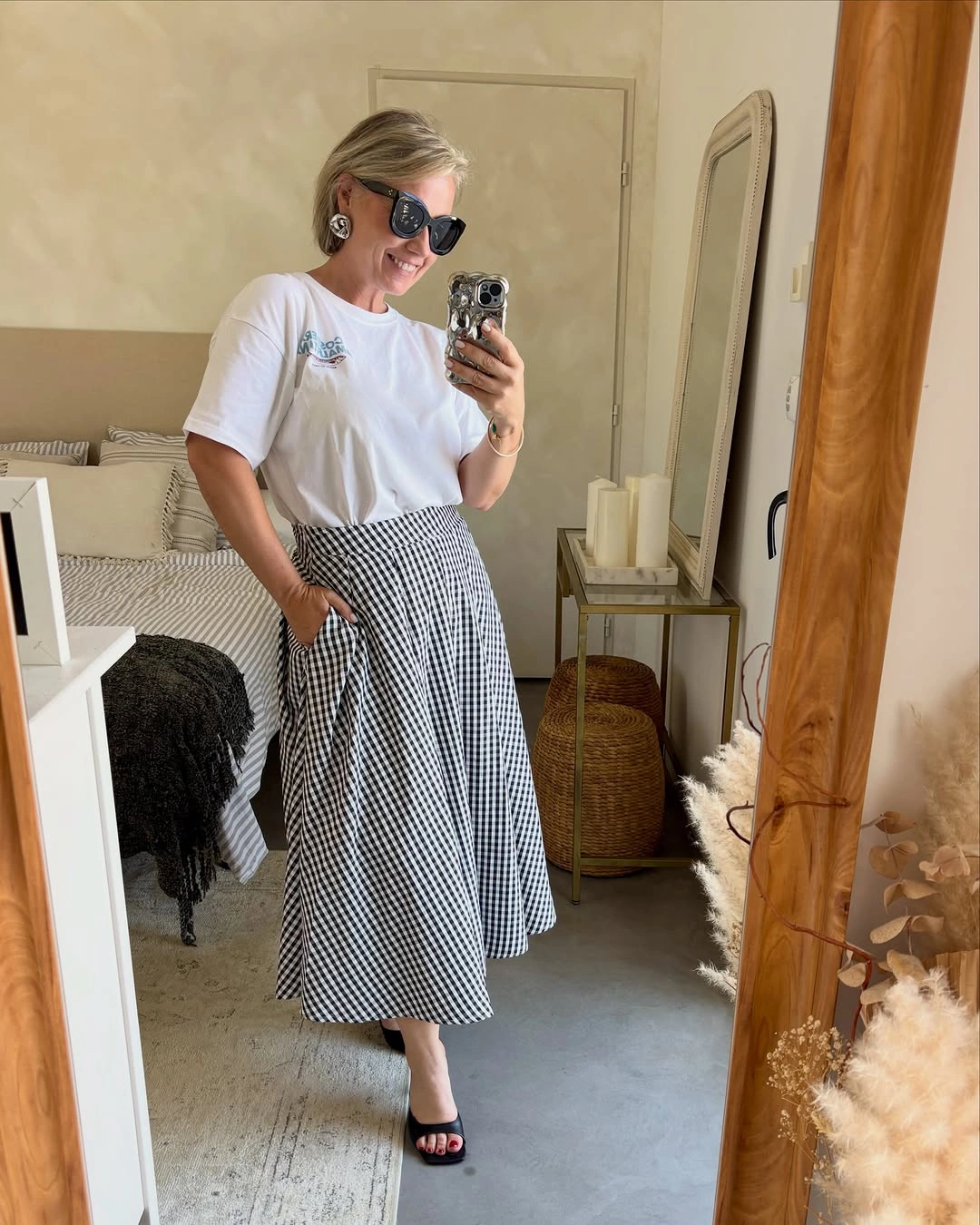 White short-sleeve top with black-and-white checked midi skirt