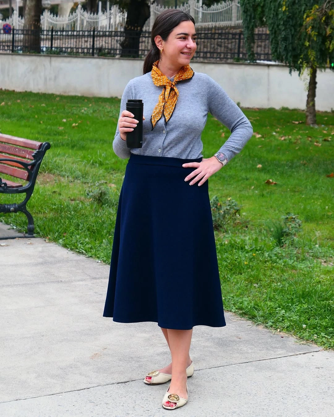 Gray cardigan with navy midi skirt and mustard neck scarf