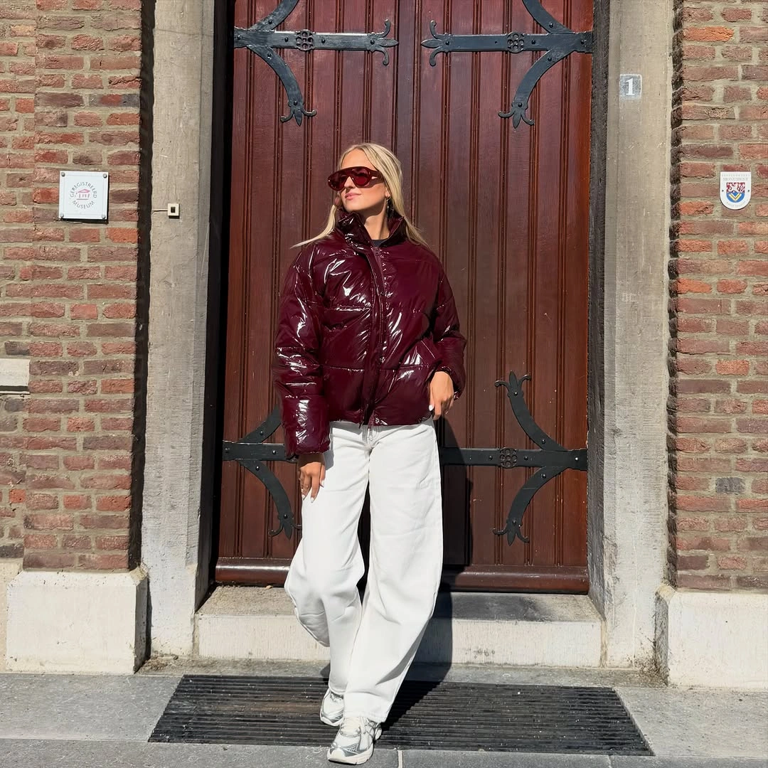 Glossy burgundy cropped puffer with pale wide trousers