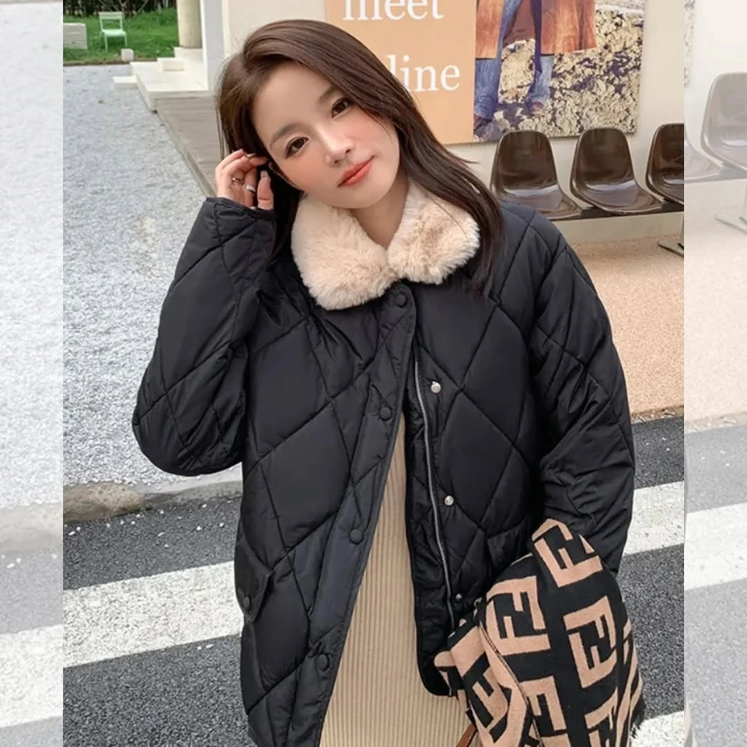 Black diamond-quilted puffer with cream fuzzy-looking collar and patterned bag