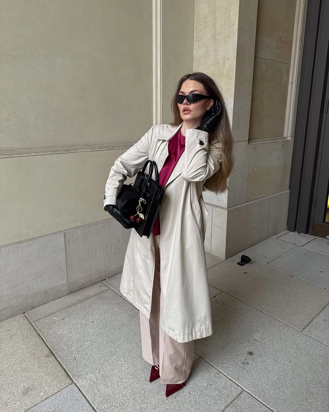 Light long coat with pale trousers and burgundy pointed shoes
