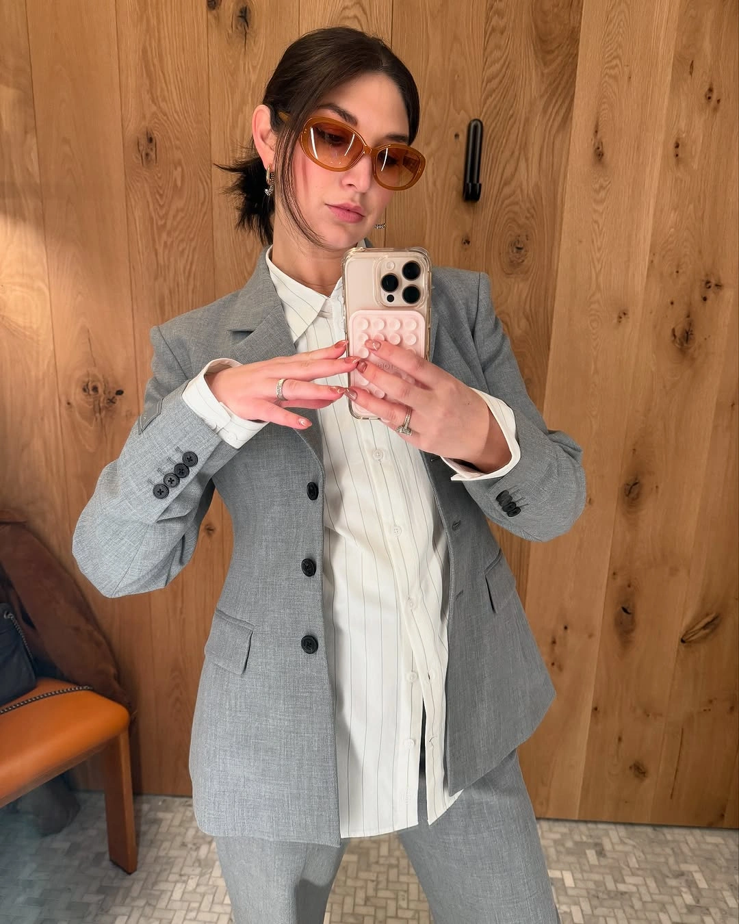Gray blazer and trousers with white vertically striped shirt