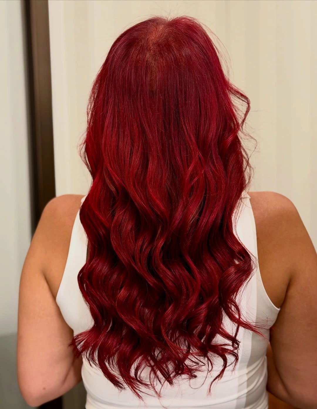 Long vivid red waves with deeper root and flowing curled lengths