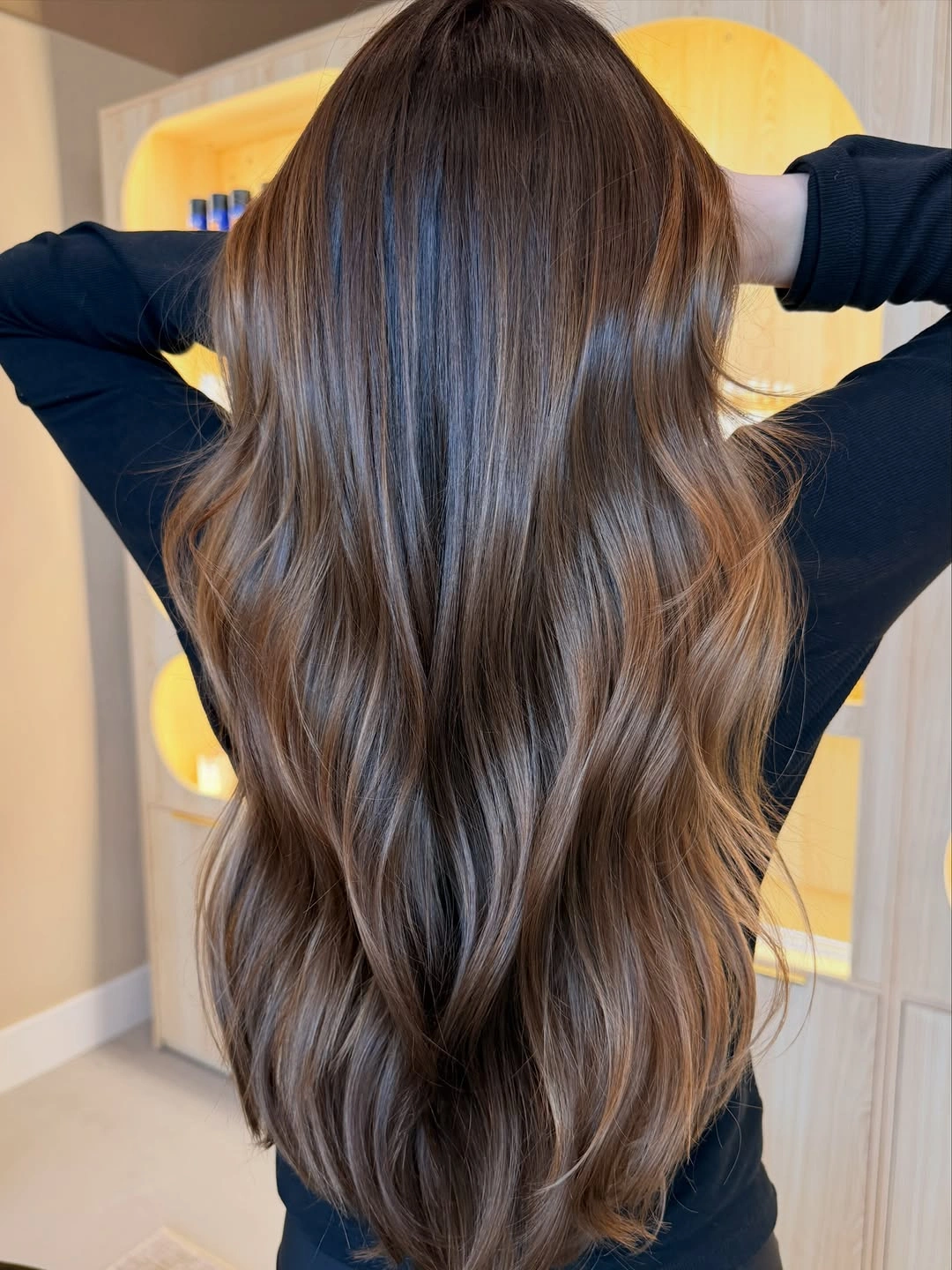 Long cool brunette waves with subtle muted lighter ribbons