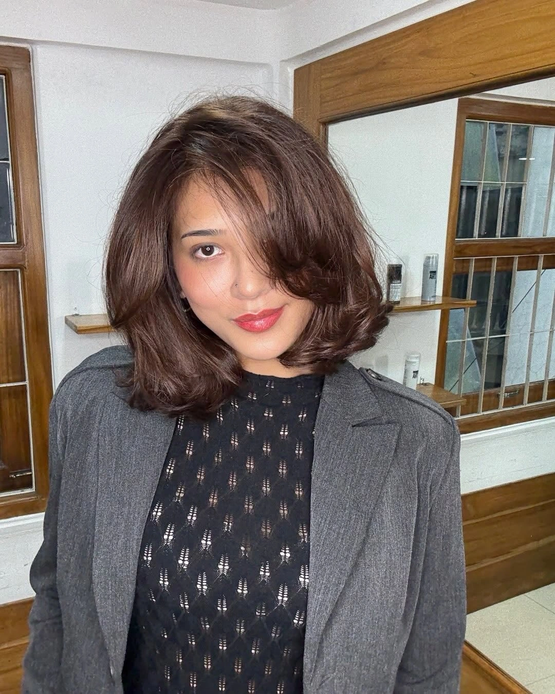 Short warm-brown rounded bob with airy side fringe and curved ends