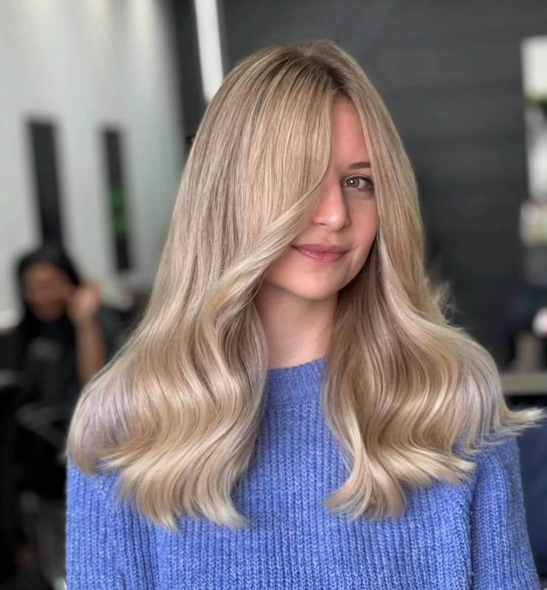 Medium beige blonde waves with creamy curved lower ends