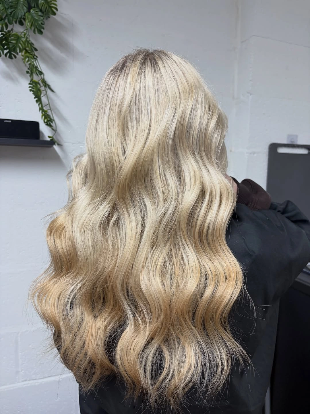 Long creamy blonde waves with warm golden lower lengths