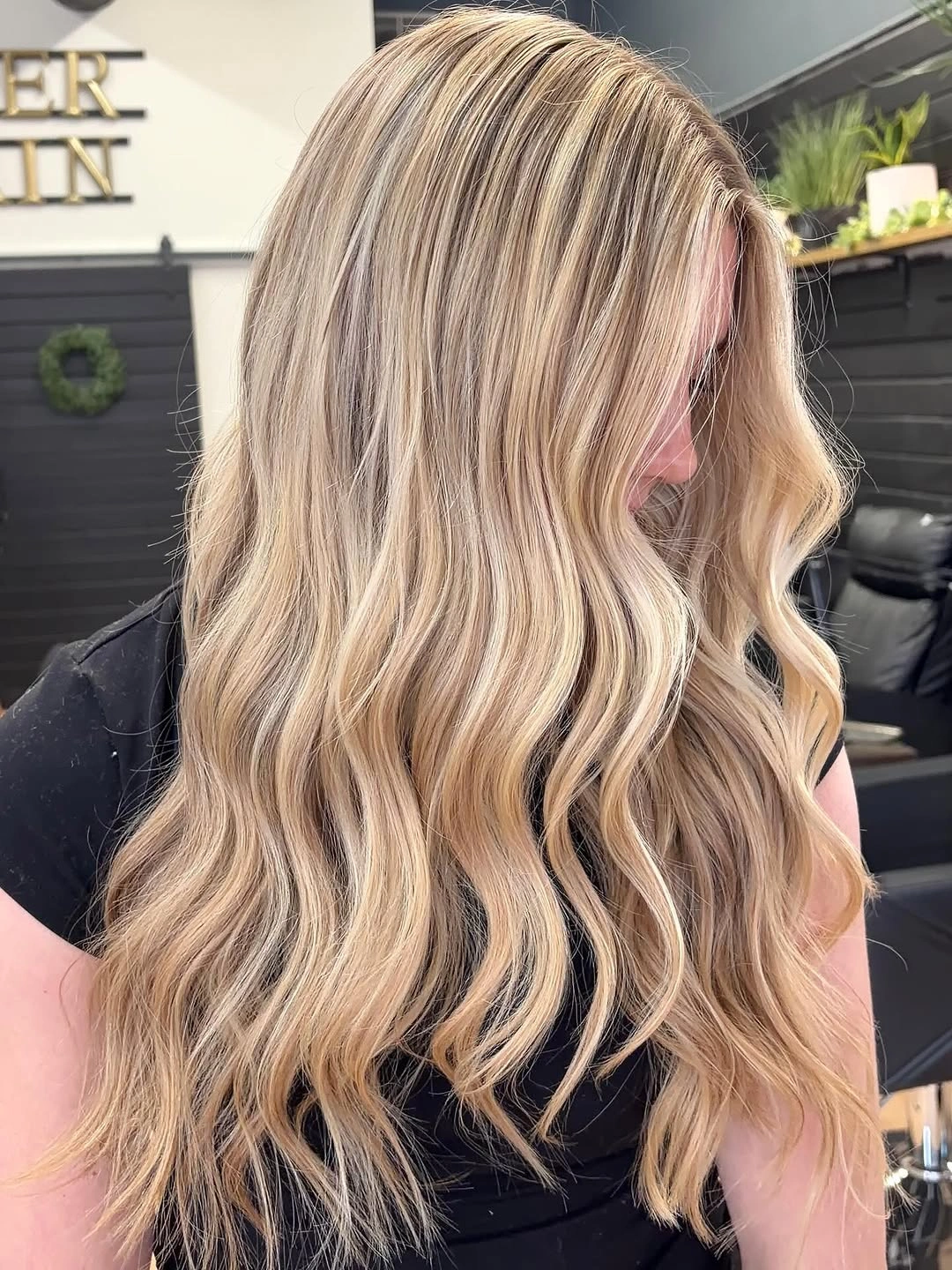 Long wavy blonde hair with beige cream and darker ribbons