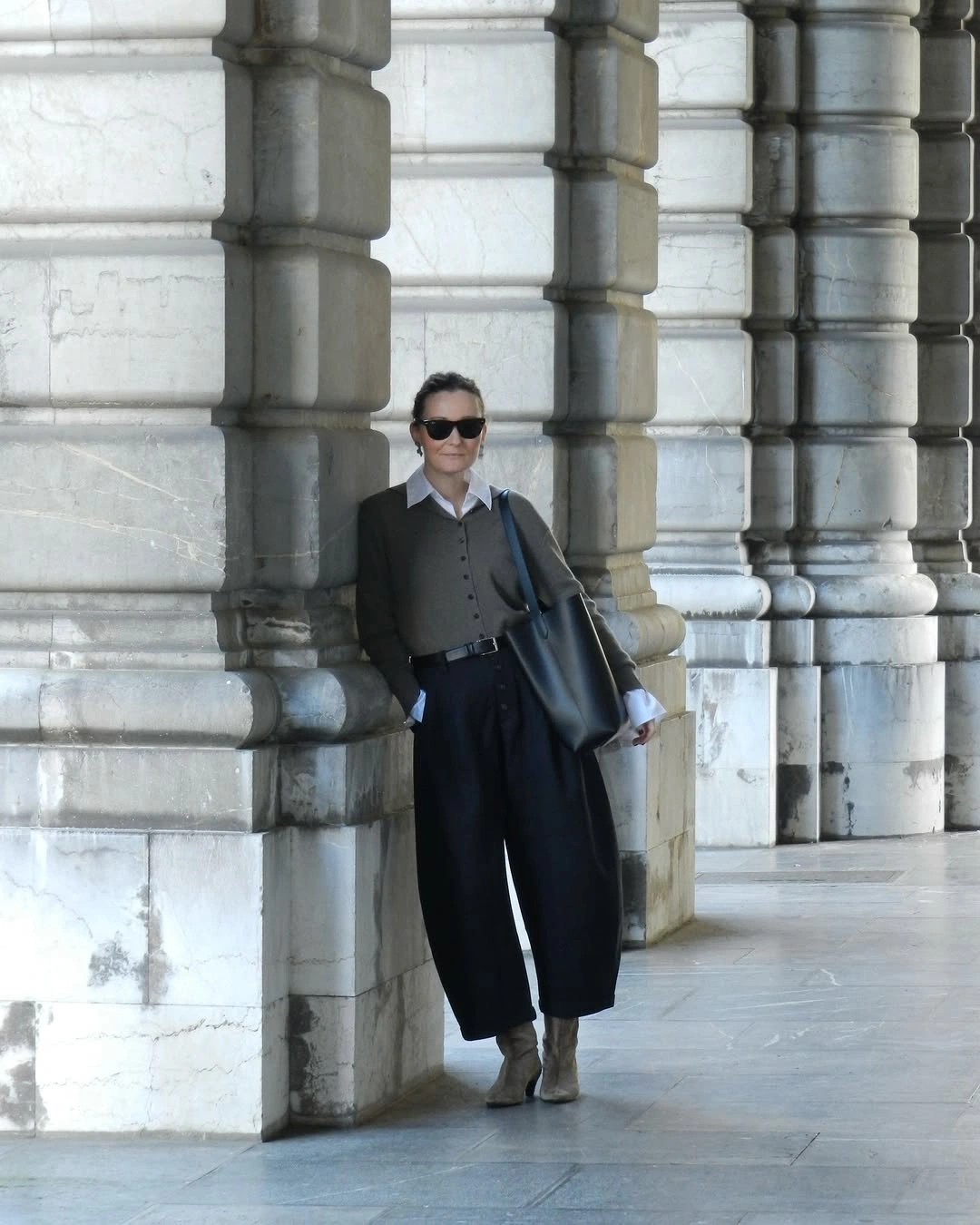 Gray waistcoat white shirt wide black trousers and taupe boots