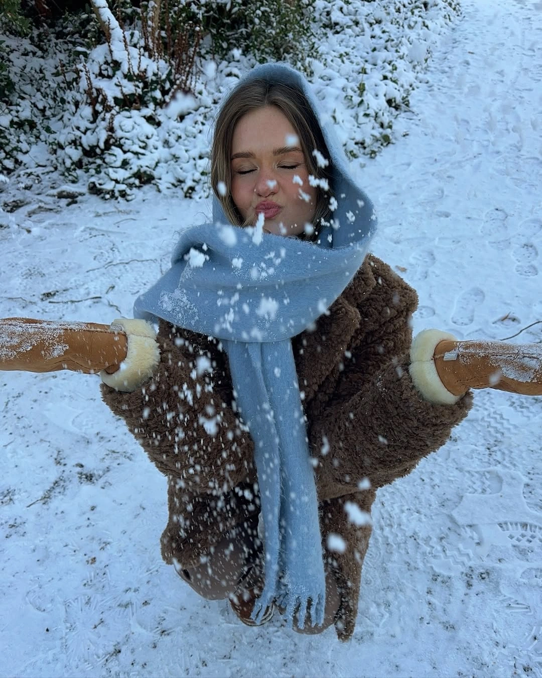 Pale blue oversized scarf with brown textured outer layer and gloves