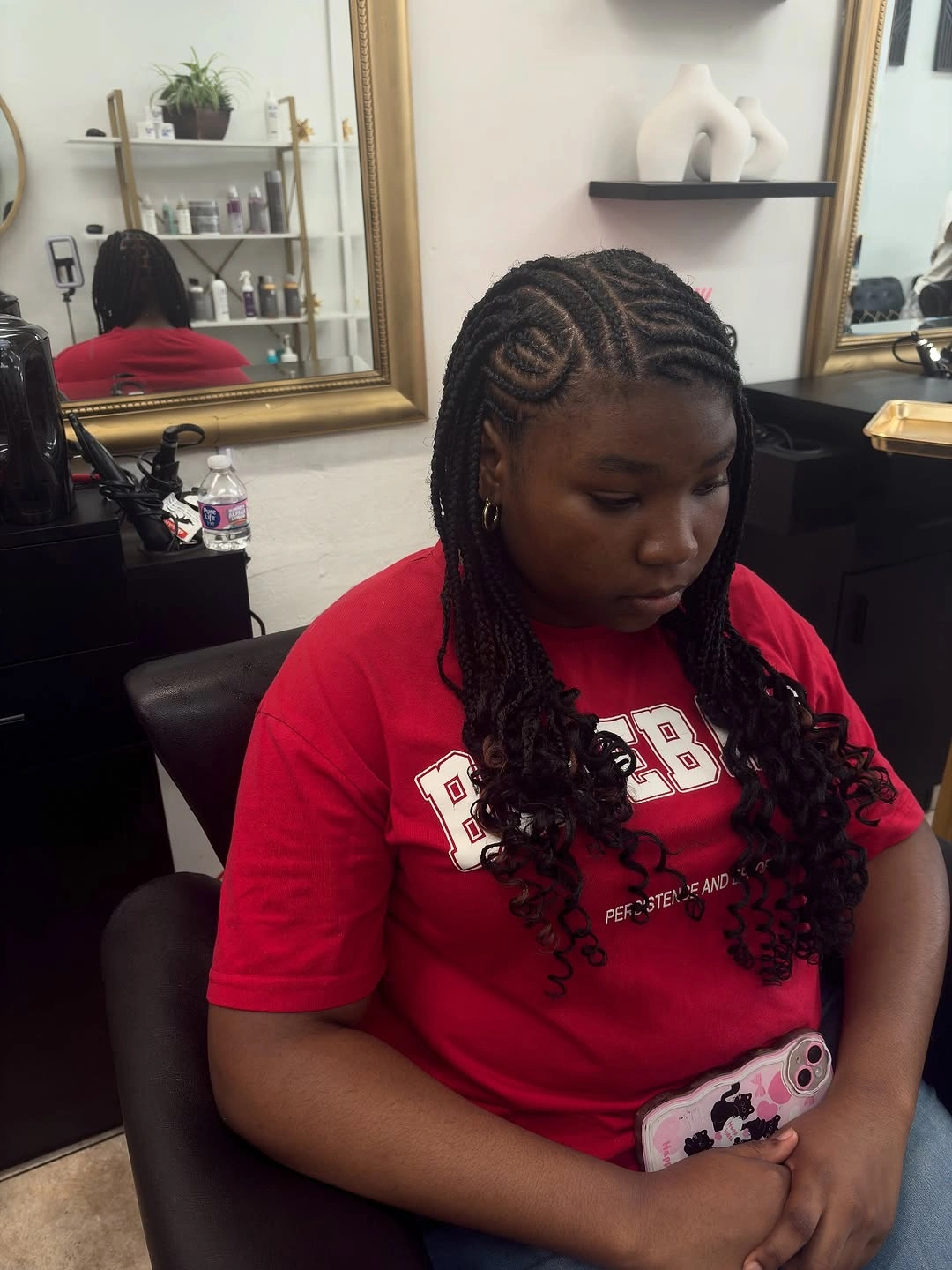 Dark curved scalp braids with spiral crown and curled ends
