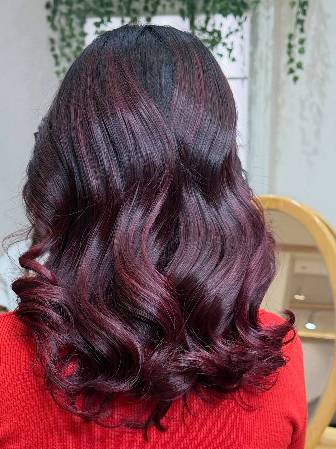 Dark mulberry-burgundy waves with blackened crown and red ends
