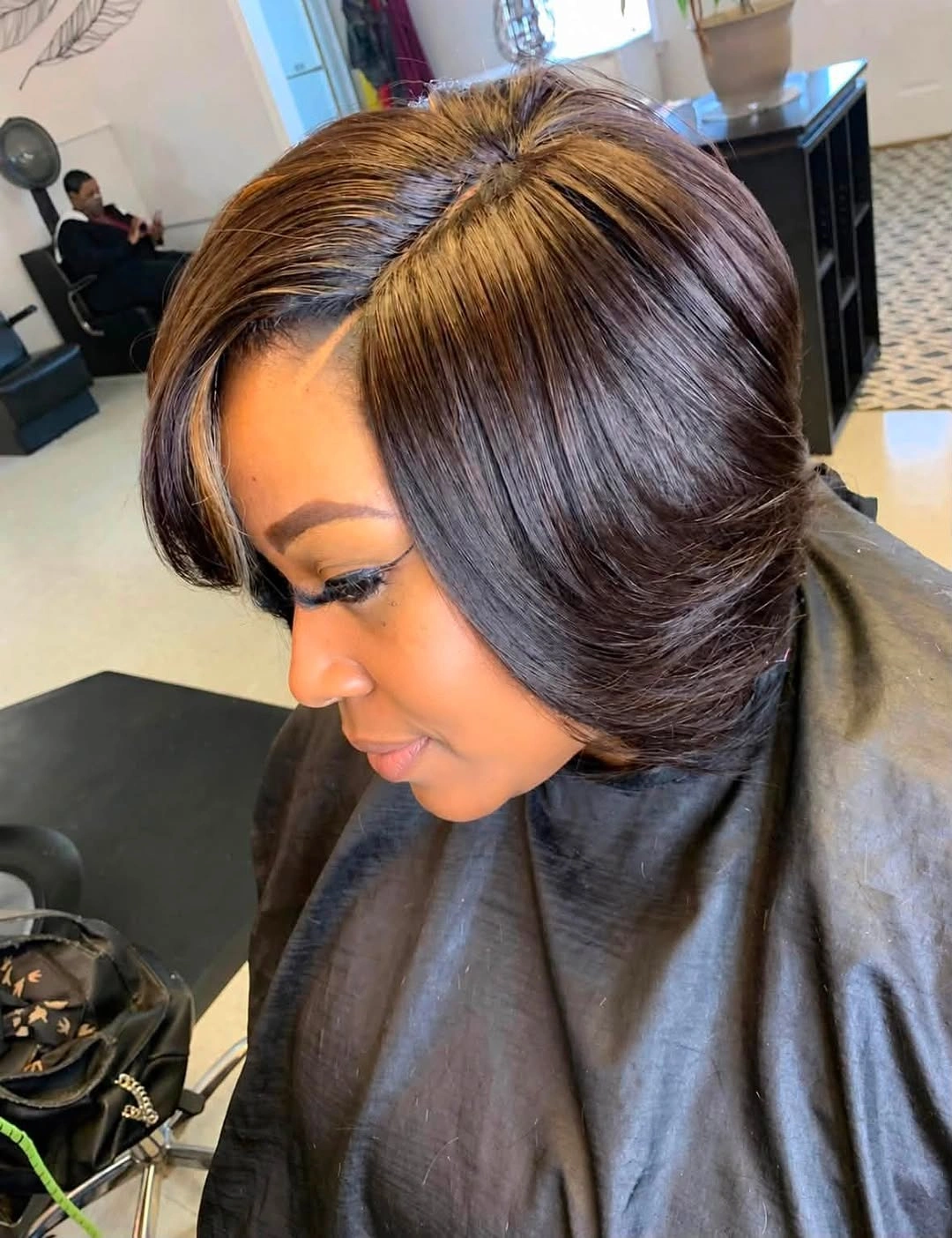Short brunette bob with caramel-golden crown and front highlights