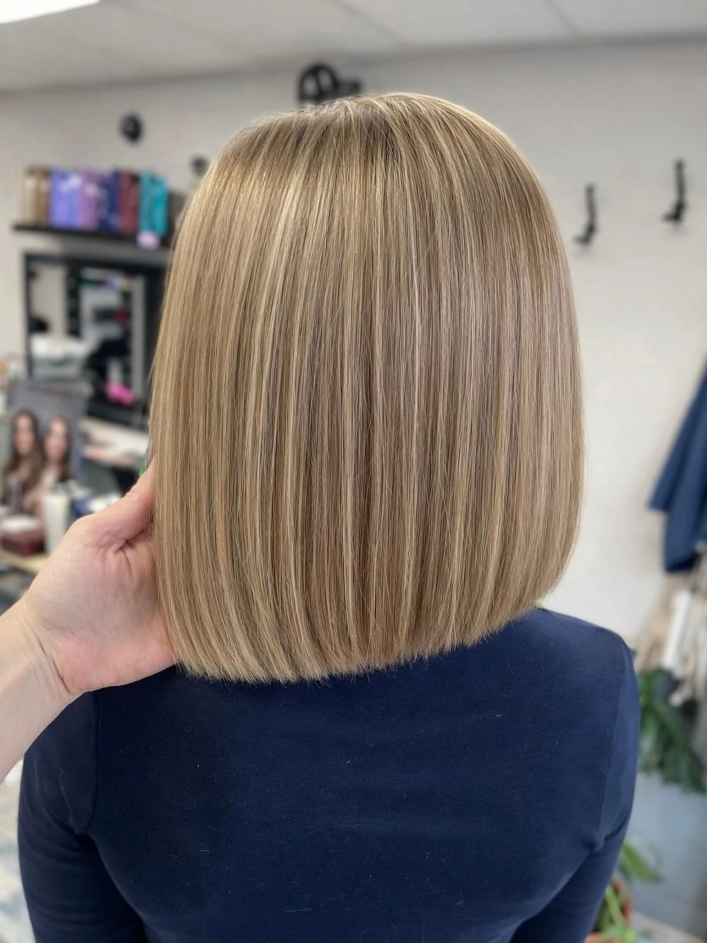 Straight blunt beige blonde bob viewed from the back