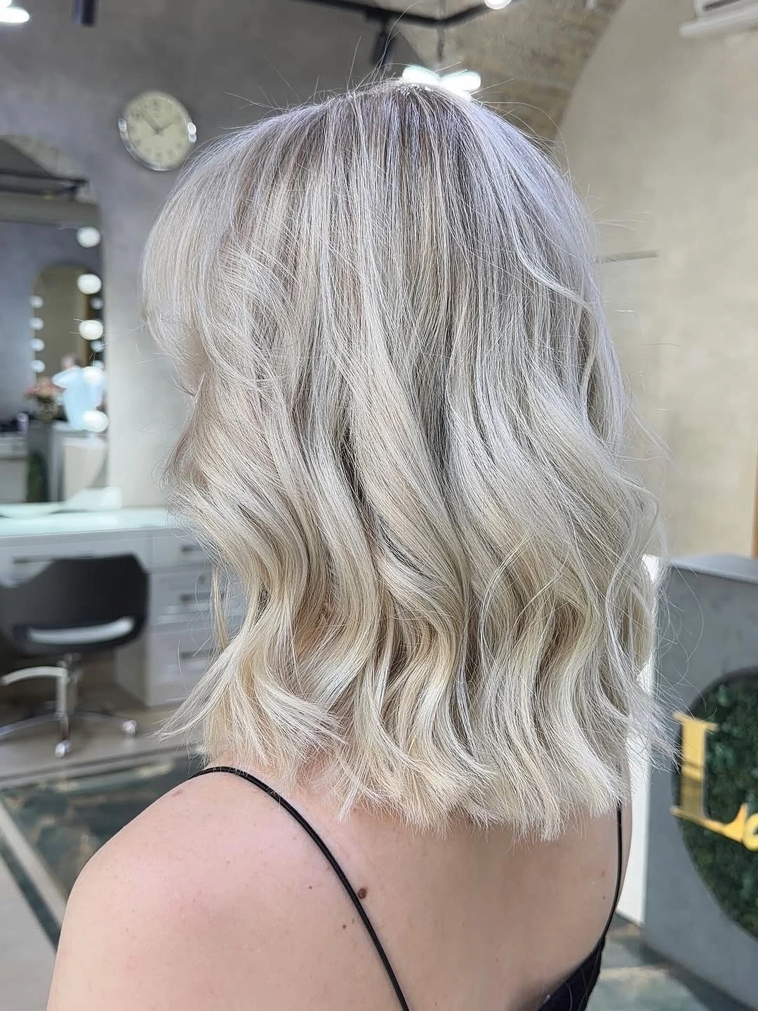 Wavy blunt lob with icy silver beige blonde color