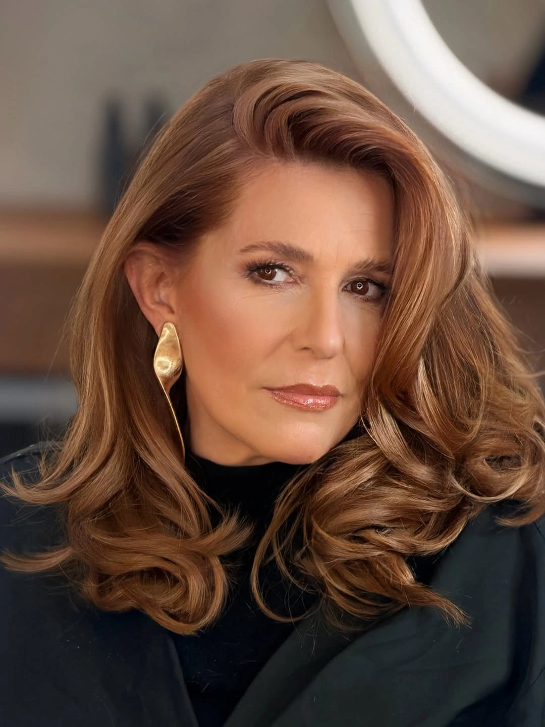 Copper auburn hair with side swept curled layers