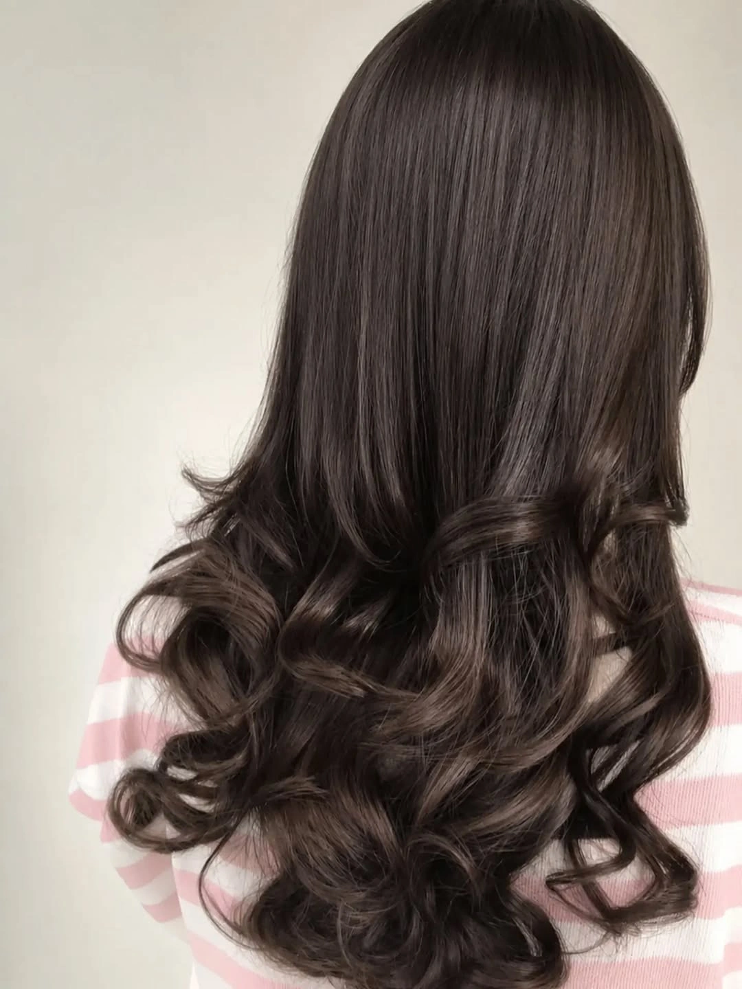 Long dark espresso brunette hair with curled lower lengths