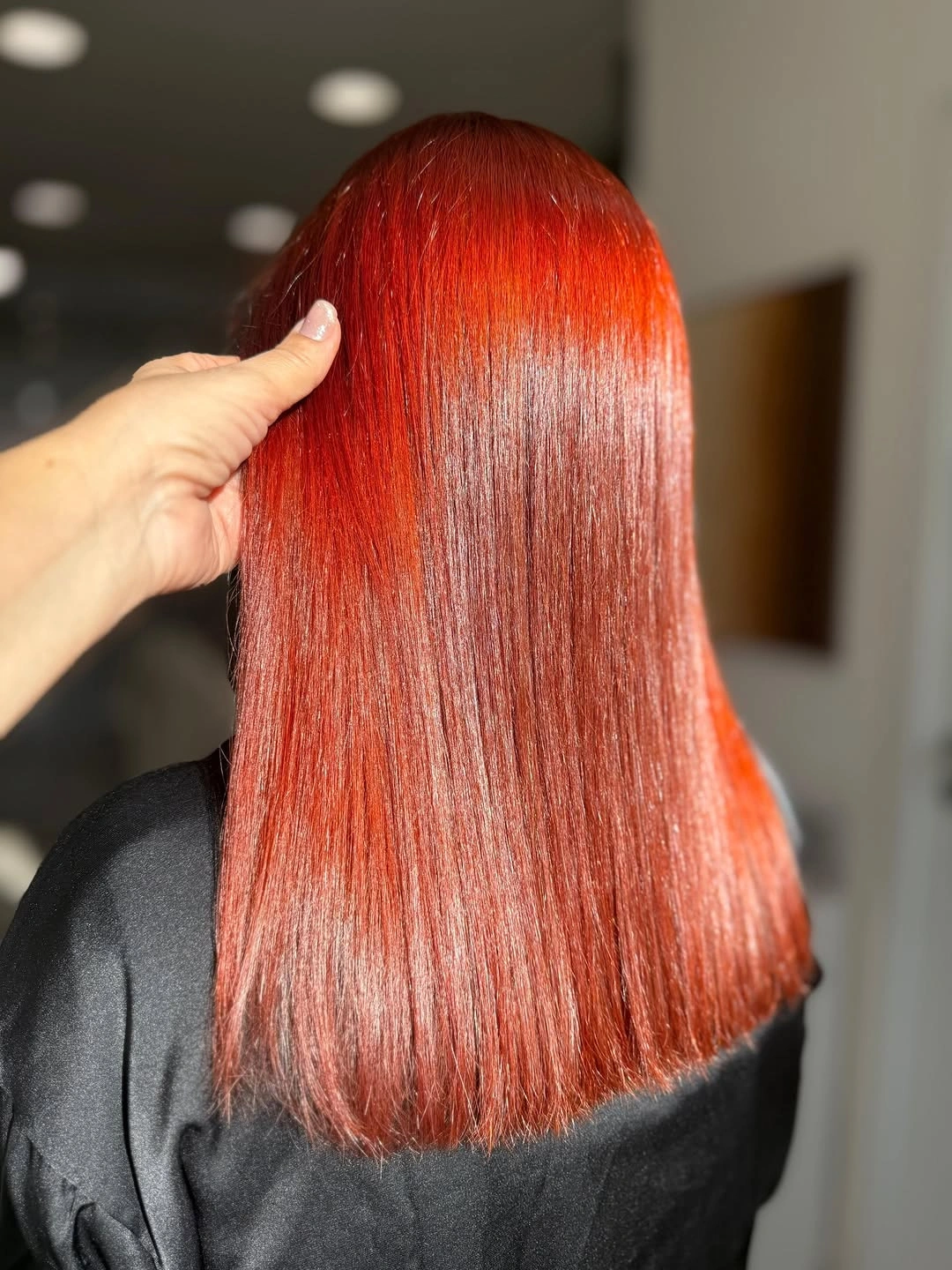Straight vivid copper red hair viewed from the back