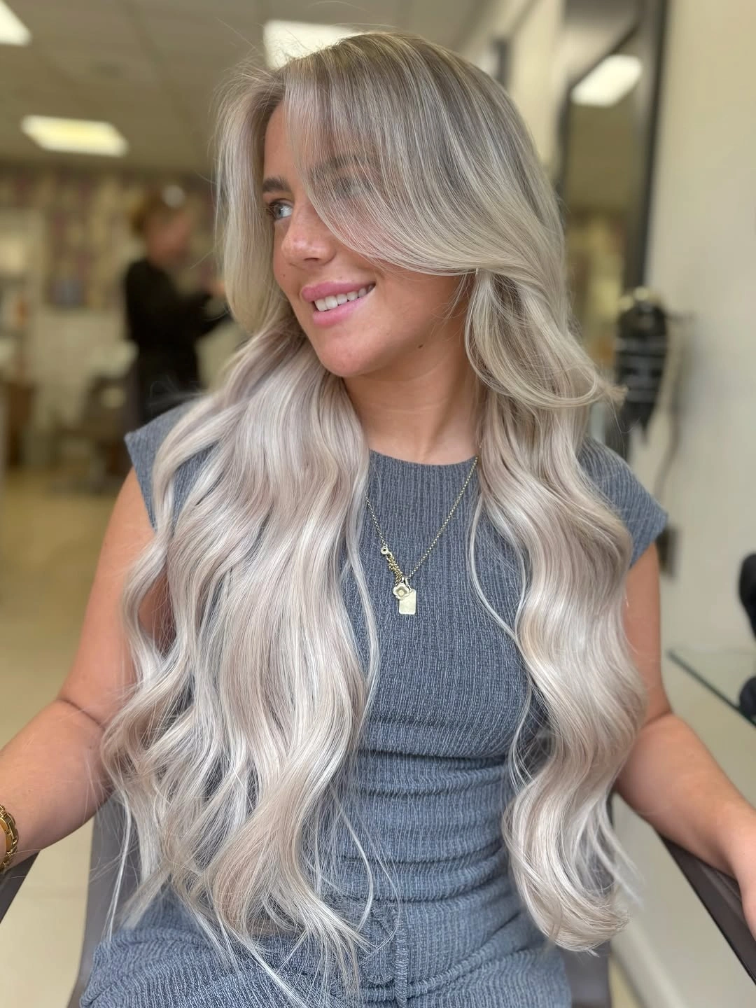 Very long pale blonde hair with sweeping face-framing sections