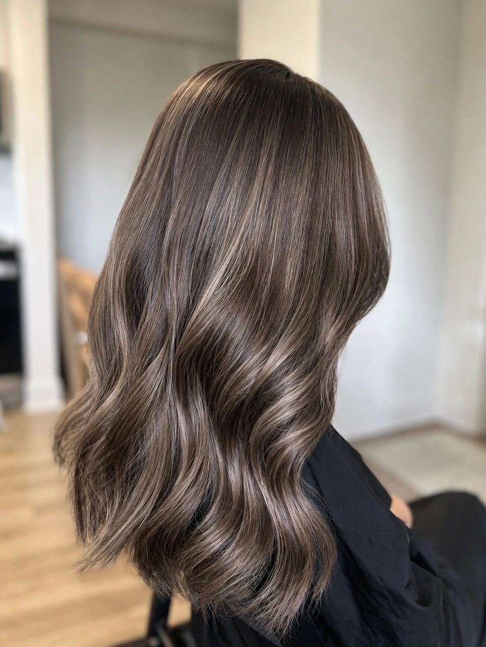 Long brunette hair with smooth crown and softly curved lower ends
