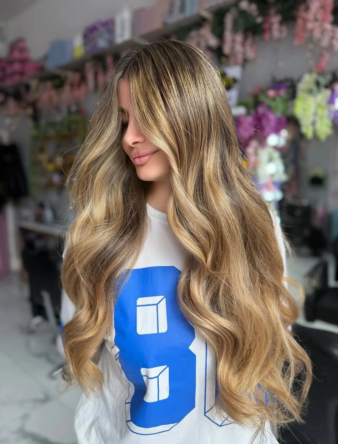 Very long blonde hair with face-framing pieces and tapered ends