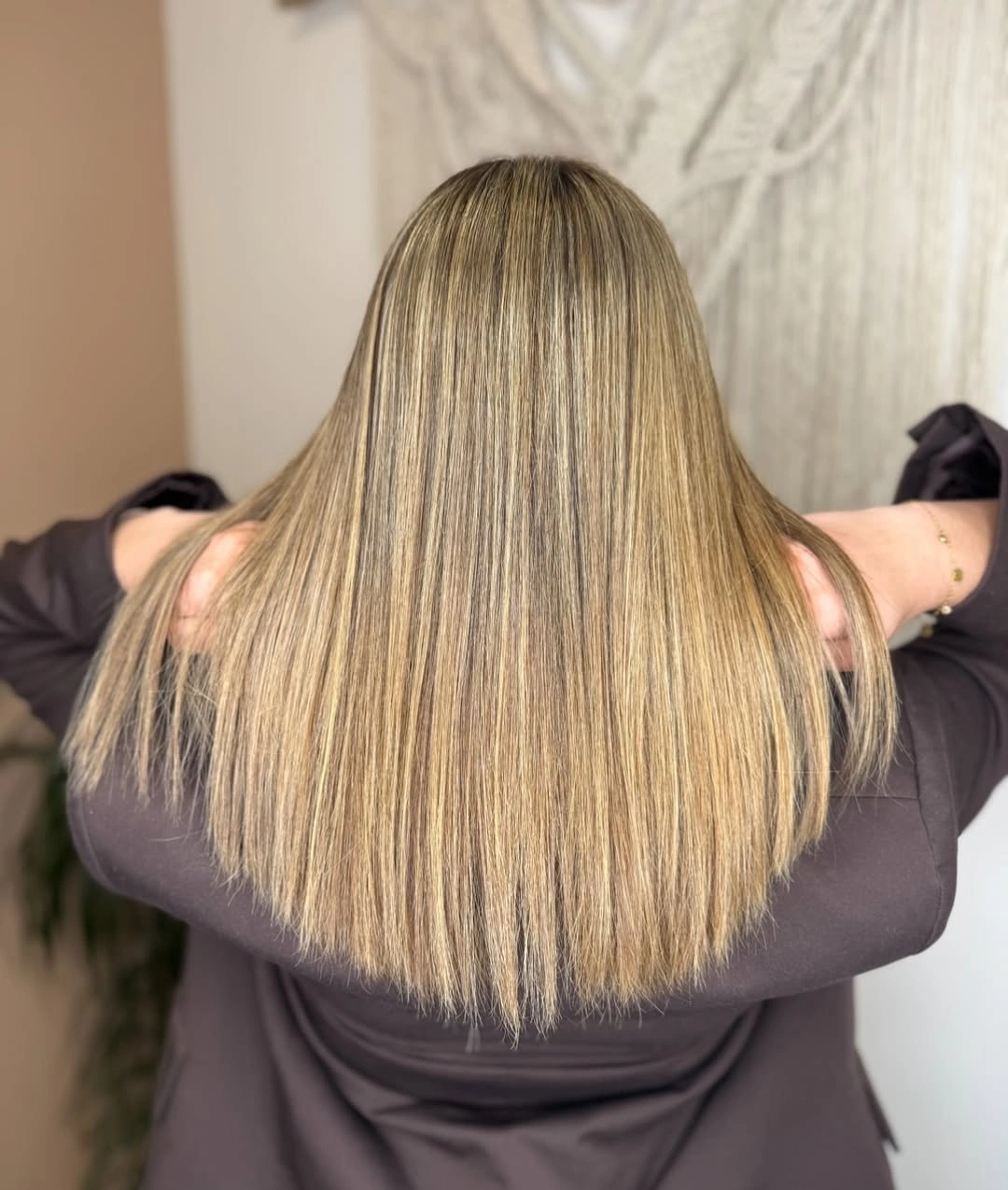 Long straight hair with broad softly curved lower perimeter