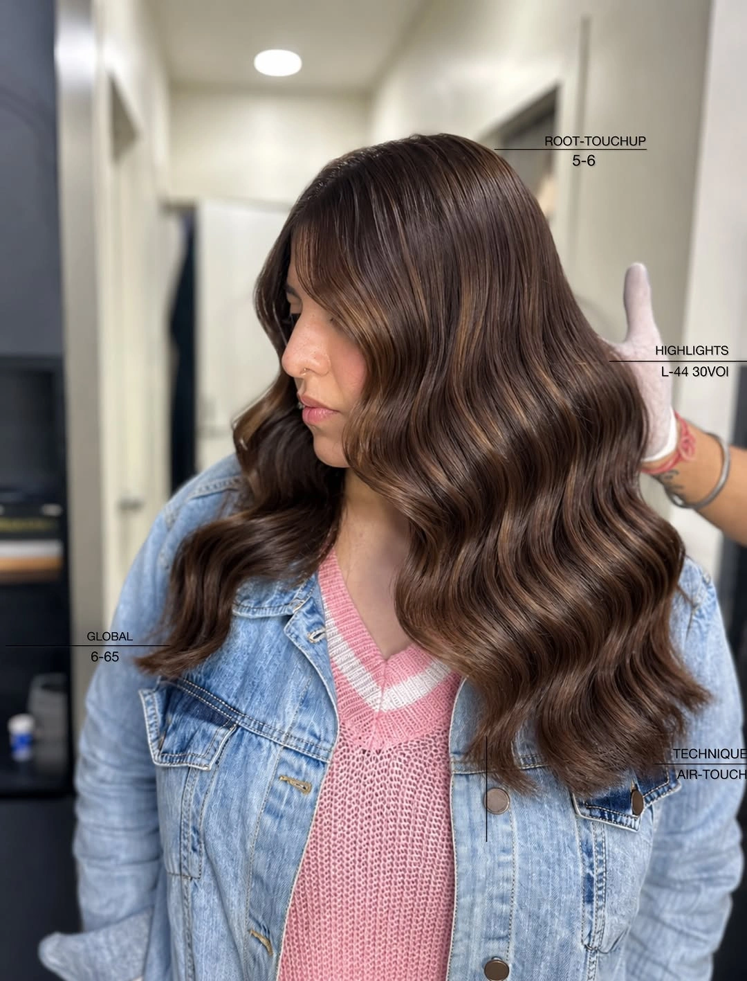 Long brunette wavy hair with side-swept front and highlights