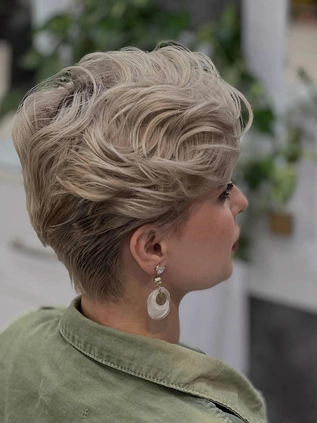 Very short cool-blonde pixie with cropped nape