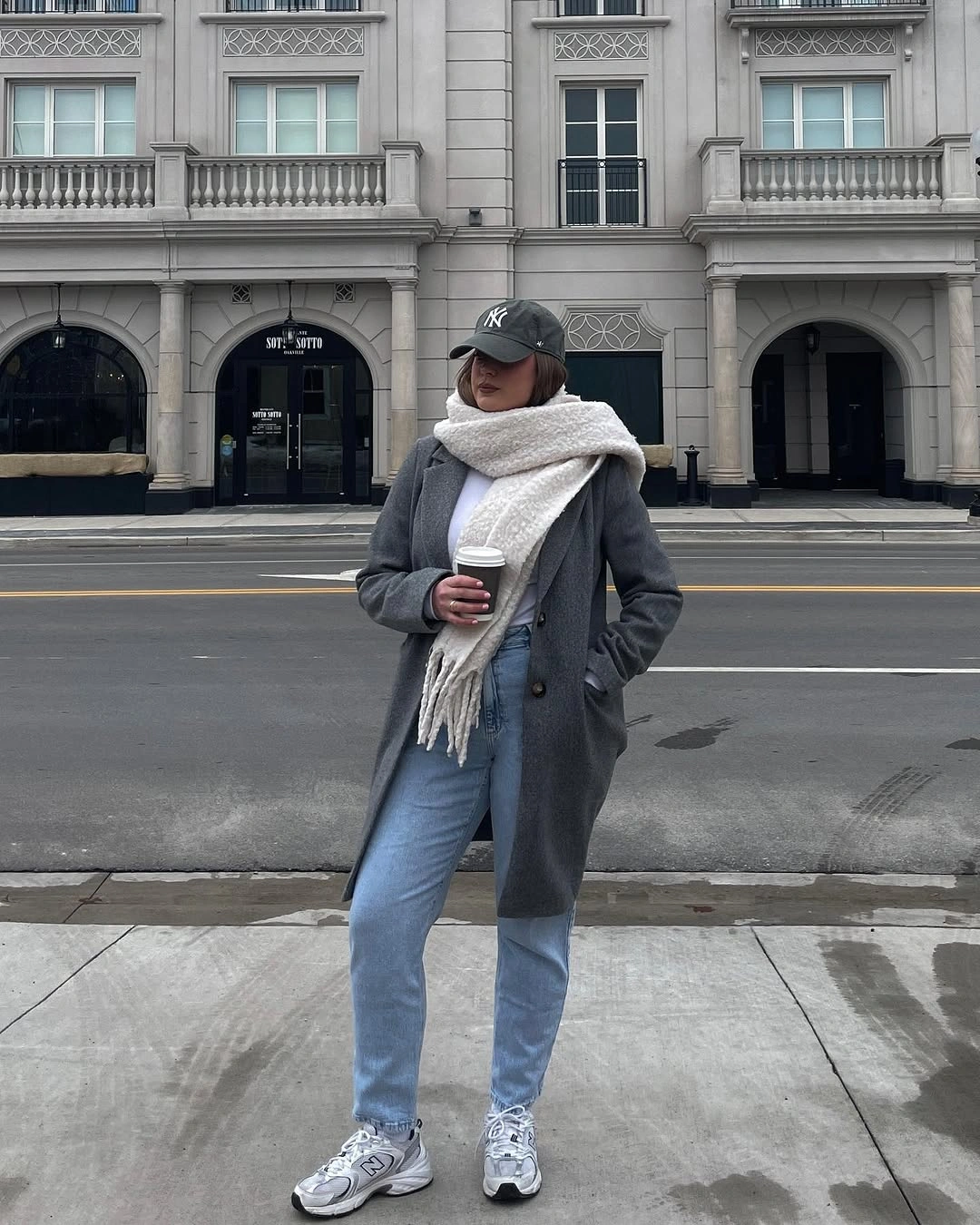 Gray long coat with cream scarf and light jeans