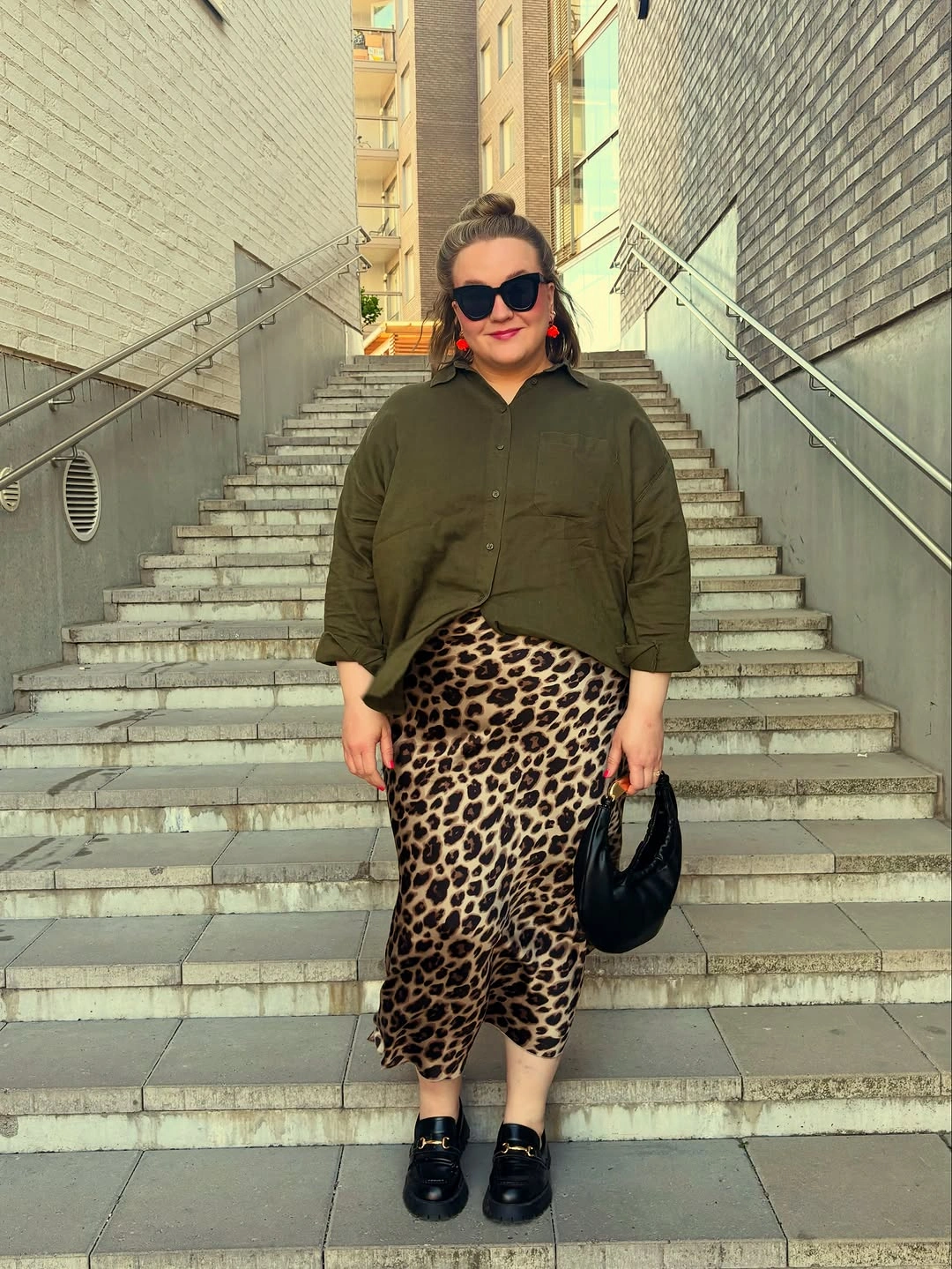 Olive shirt with leopard skirt and black loafers