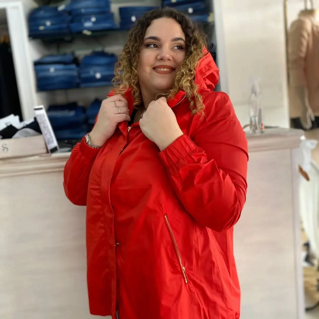 Bright red hooded jacket with visible zipper details