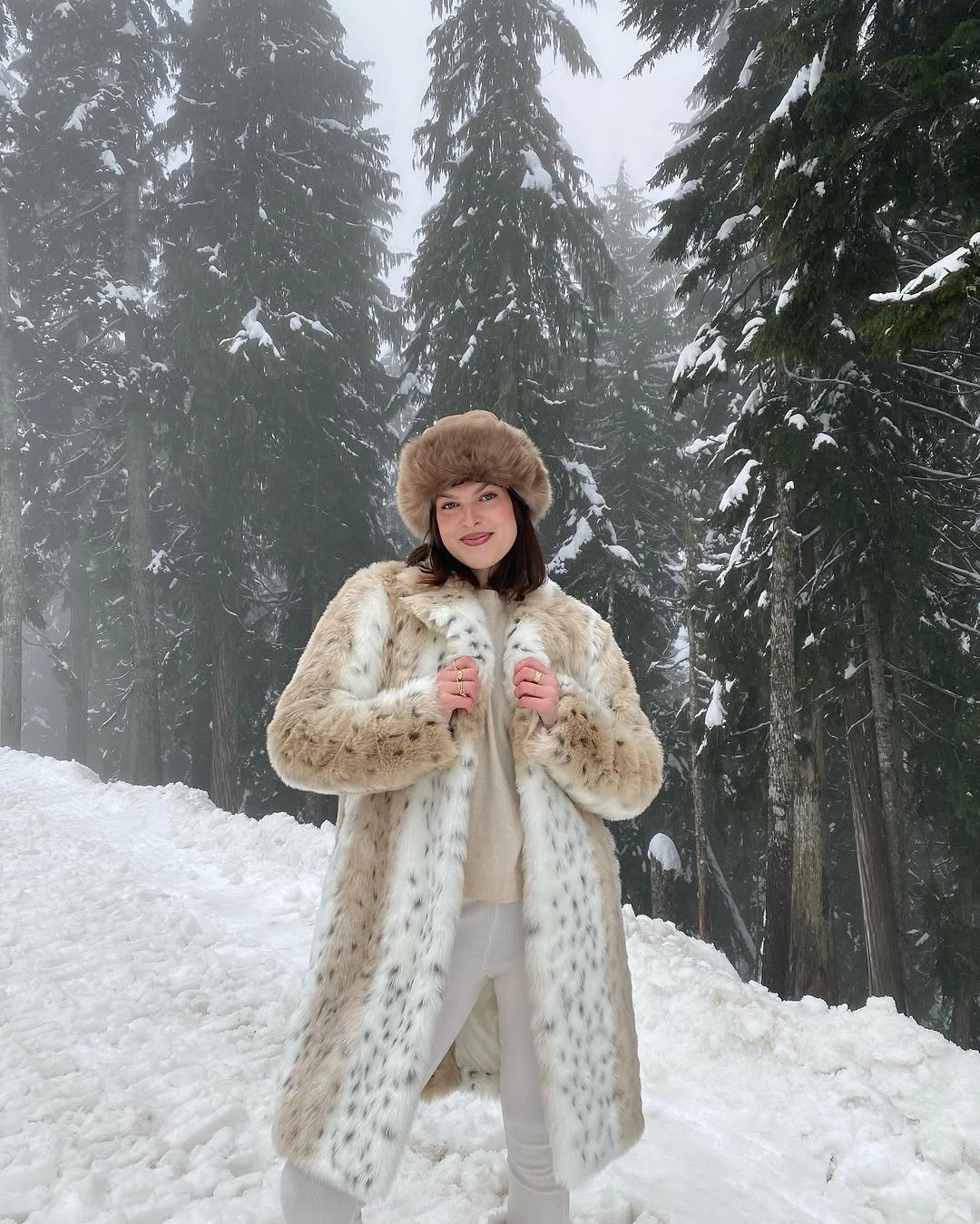Printed cream furry coat with fur hat and white trousers