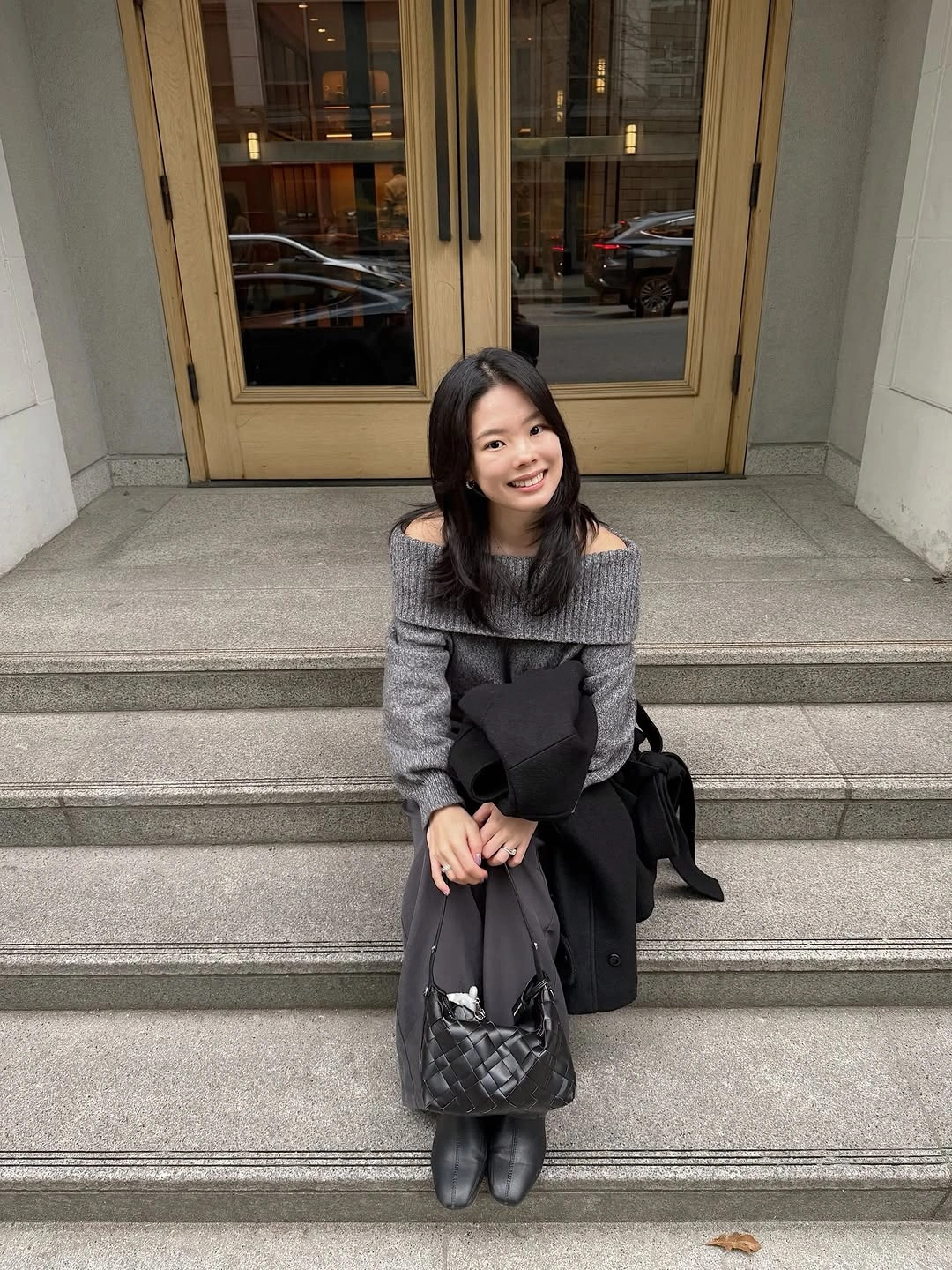 Gray knit dress with black tights and knee-high boots