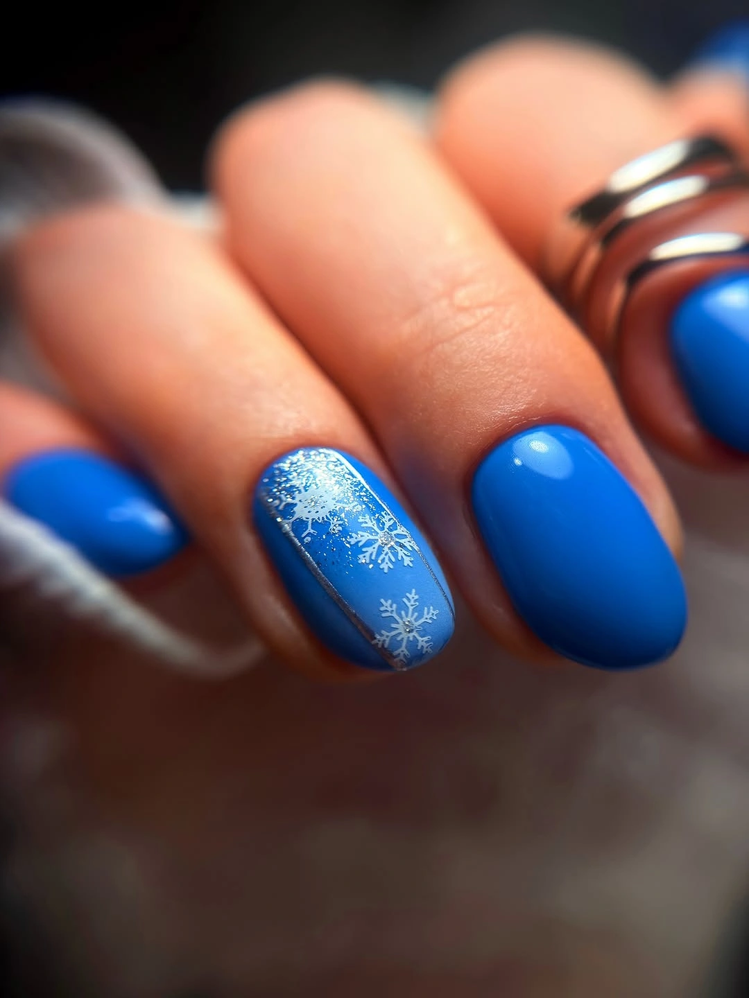 Bright cobalt short nails with white snowflake accent