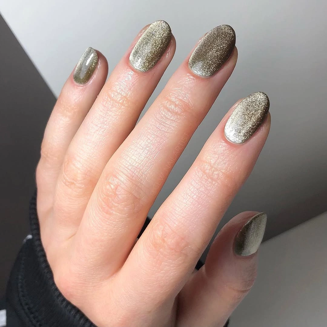 Champagne metallic short almond nails with reflective shimmer glow