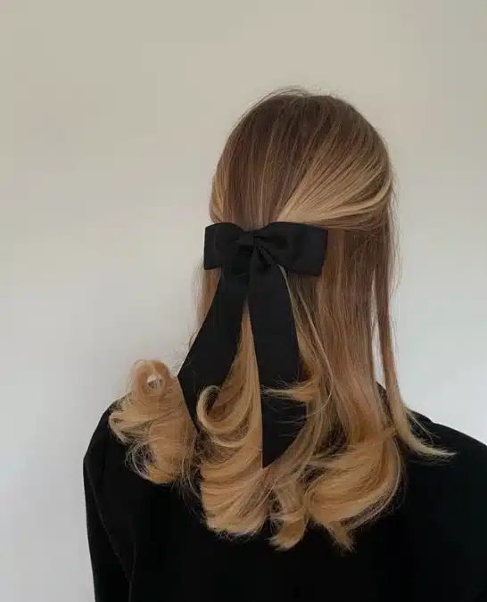 Half Updo With Black Bow Accessory — Winter Hairstyles for Work