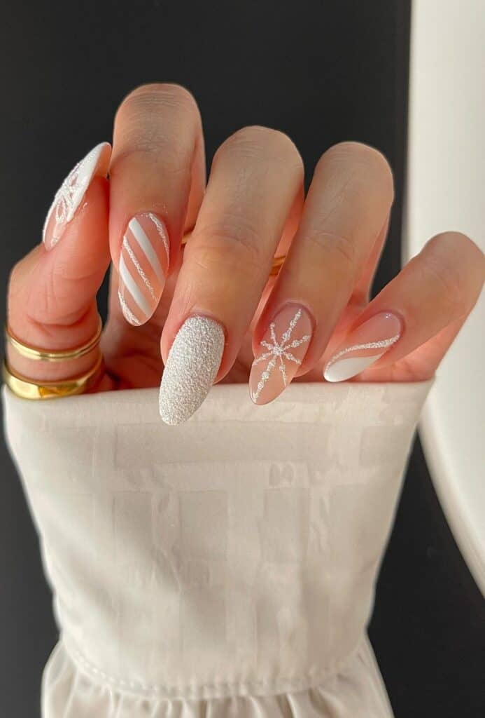 Textured Glitter & Snowflake Winter Art Textured Glitter & Snowflake Winter Art β Long Winter Almond Nails