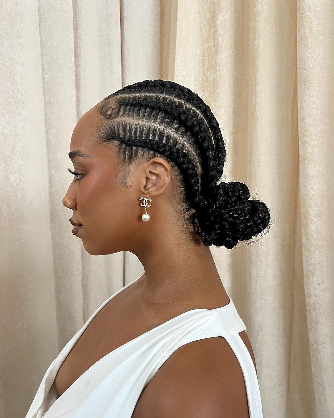 Cornrows Into A Sleek Textured Bun Cornrows Into A Sleek Textured Bun β Winter Hairstyles for Black Kids