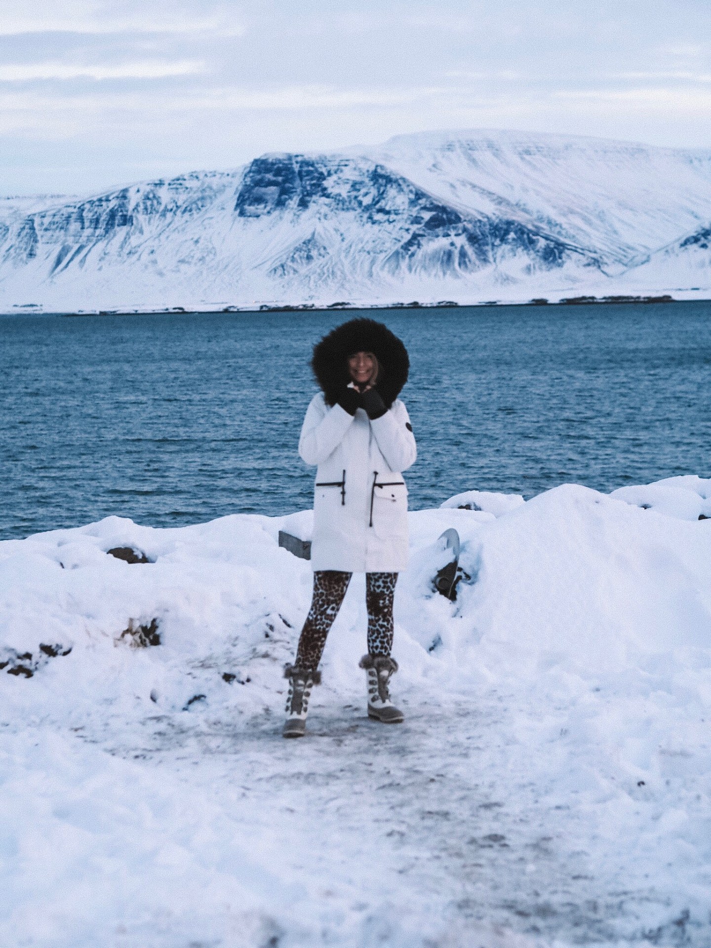White Parka With Fur-Trimmed Hood And Leopard Print Leggings White Parka With Fur-Trimmed Hood And Leopard Print Leggings β Iceland Winter Outfits