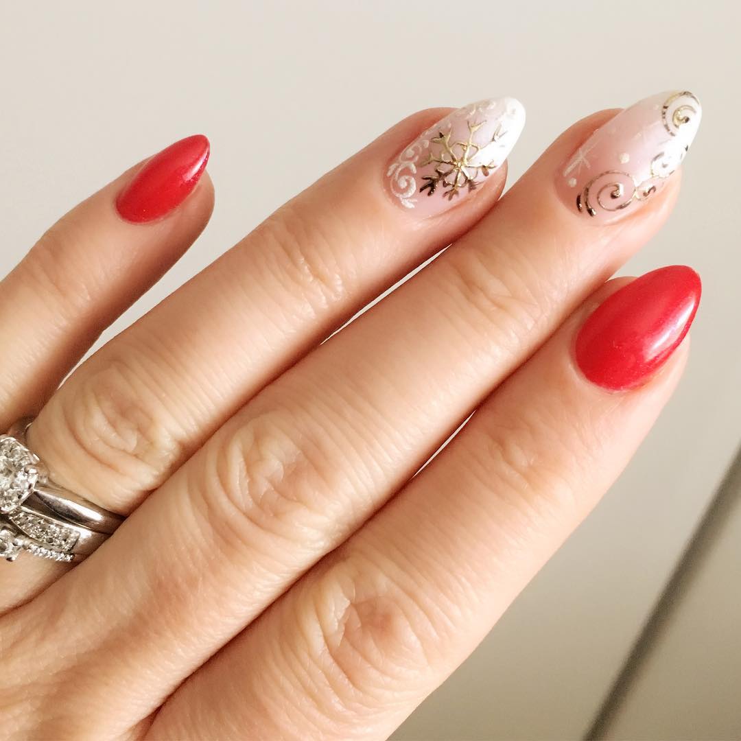 Bright Red with Gold Snowflake Swirls Bright Red with Gold Snowflake Swirls β Christmas Almond Nails 2026