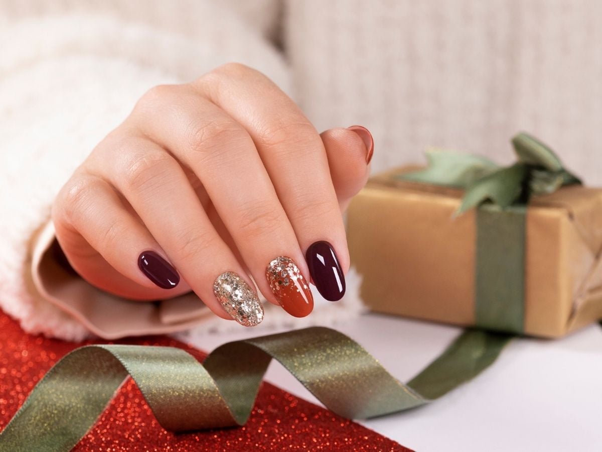 Oval Burgundy Gold Glitter Accent — Simple New Years Nails 2027