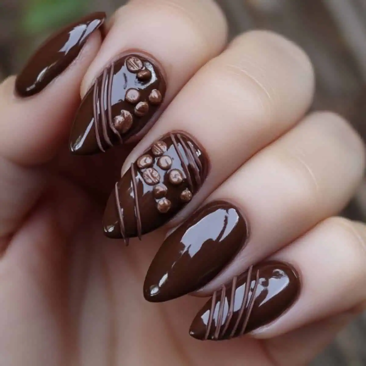 Chocolate Drizzle 3D Bean Stiletto Chocolate Drizzle 3D Bean Stiletto β Winter Nail Colors for Brown Skin