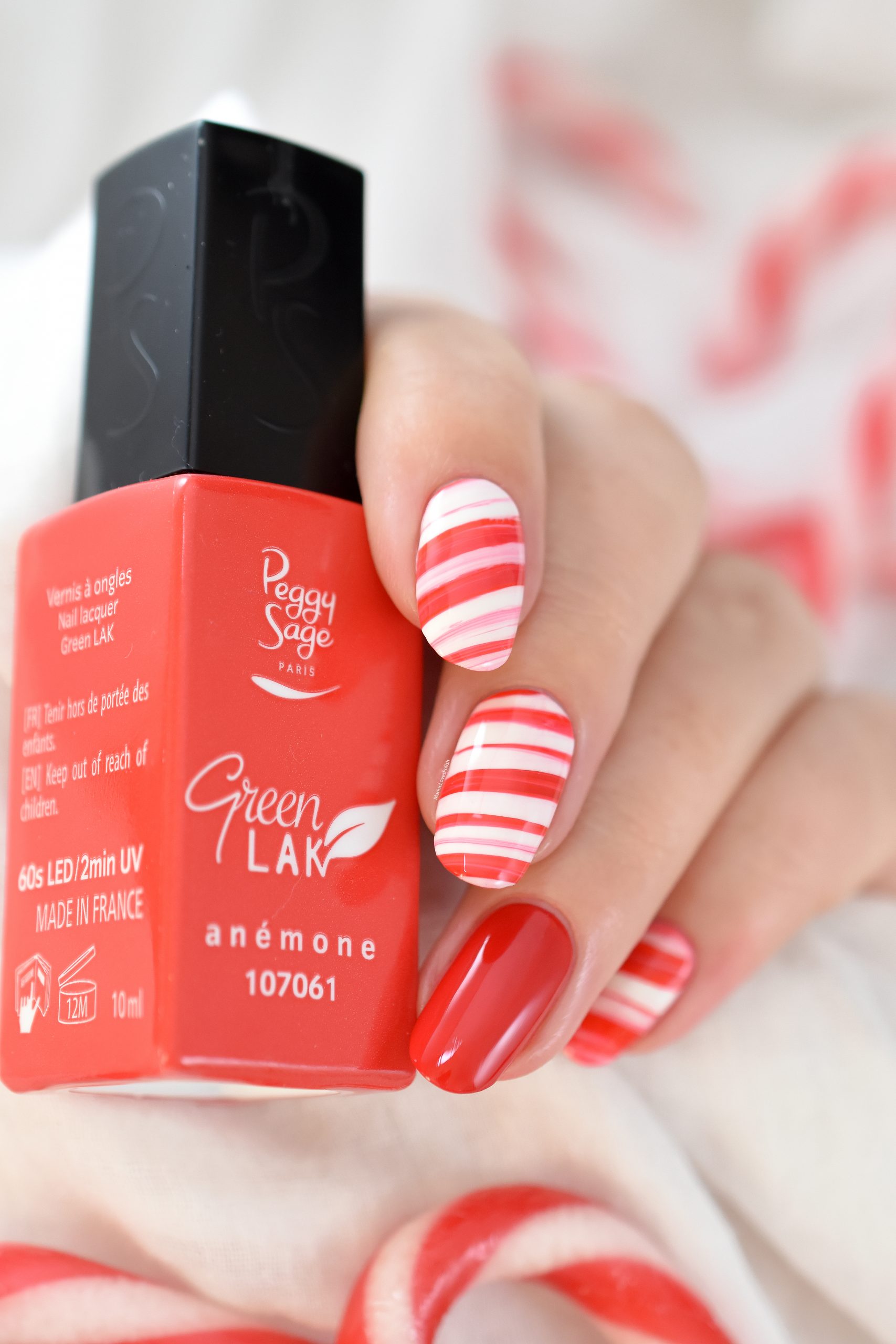 Red and White Candy Cane Stripe Oval Nails — Christmas Nails for Kids 2026