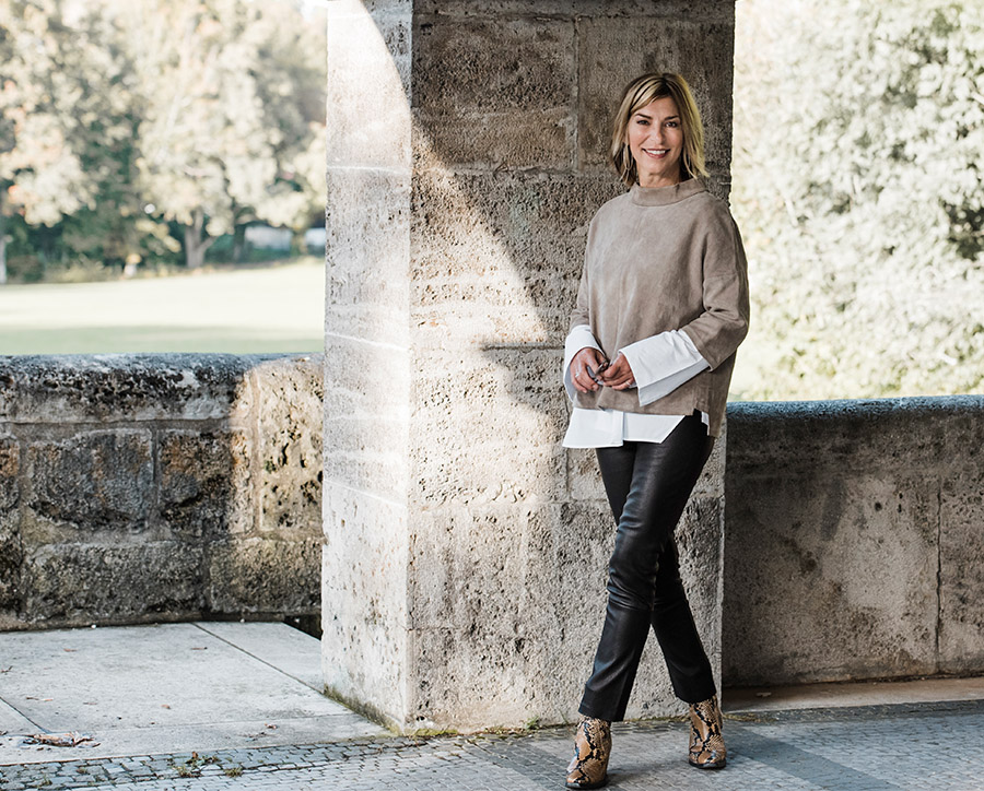 Black Leather Pants with Oversized Sweater, Shirt Cuffs, and Snakeskin Boots — Leather Pants Outfits