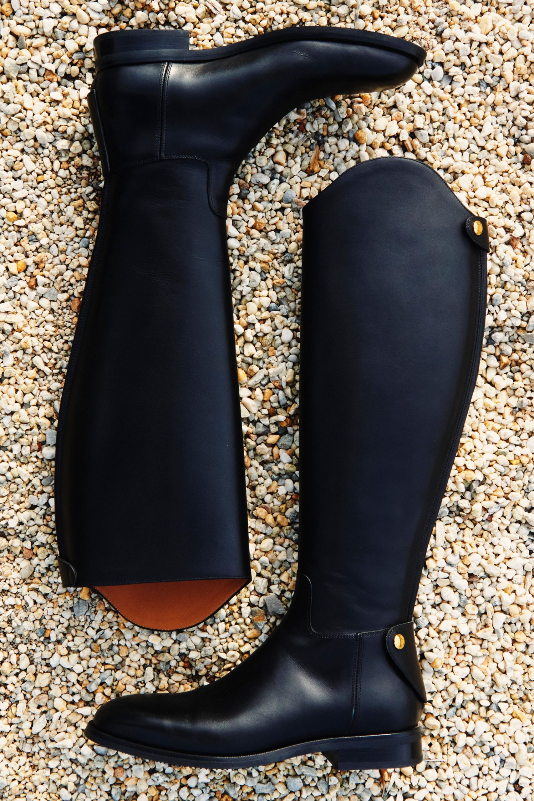 Autumn Essential: Sleek Black Riding Boots on Pebbles Autumn Essential: Sleek Black Riding Boots on Pebbles β Riding Boots Outfits