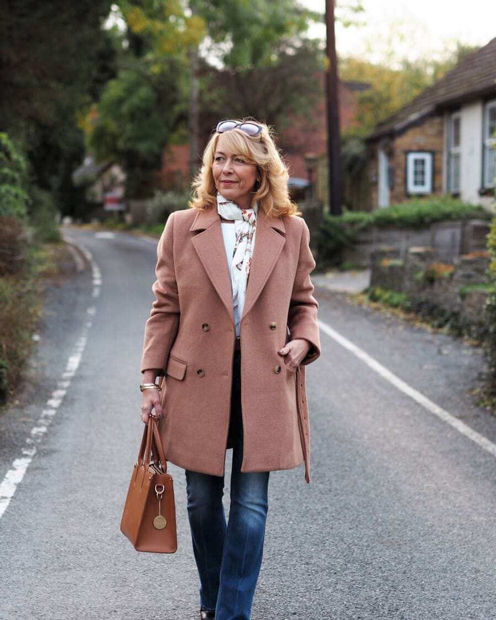 Camel Coat Over White Blouse, Jeans, and Patterned Scarf — Camel Coat Outfits