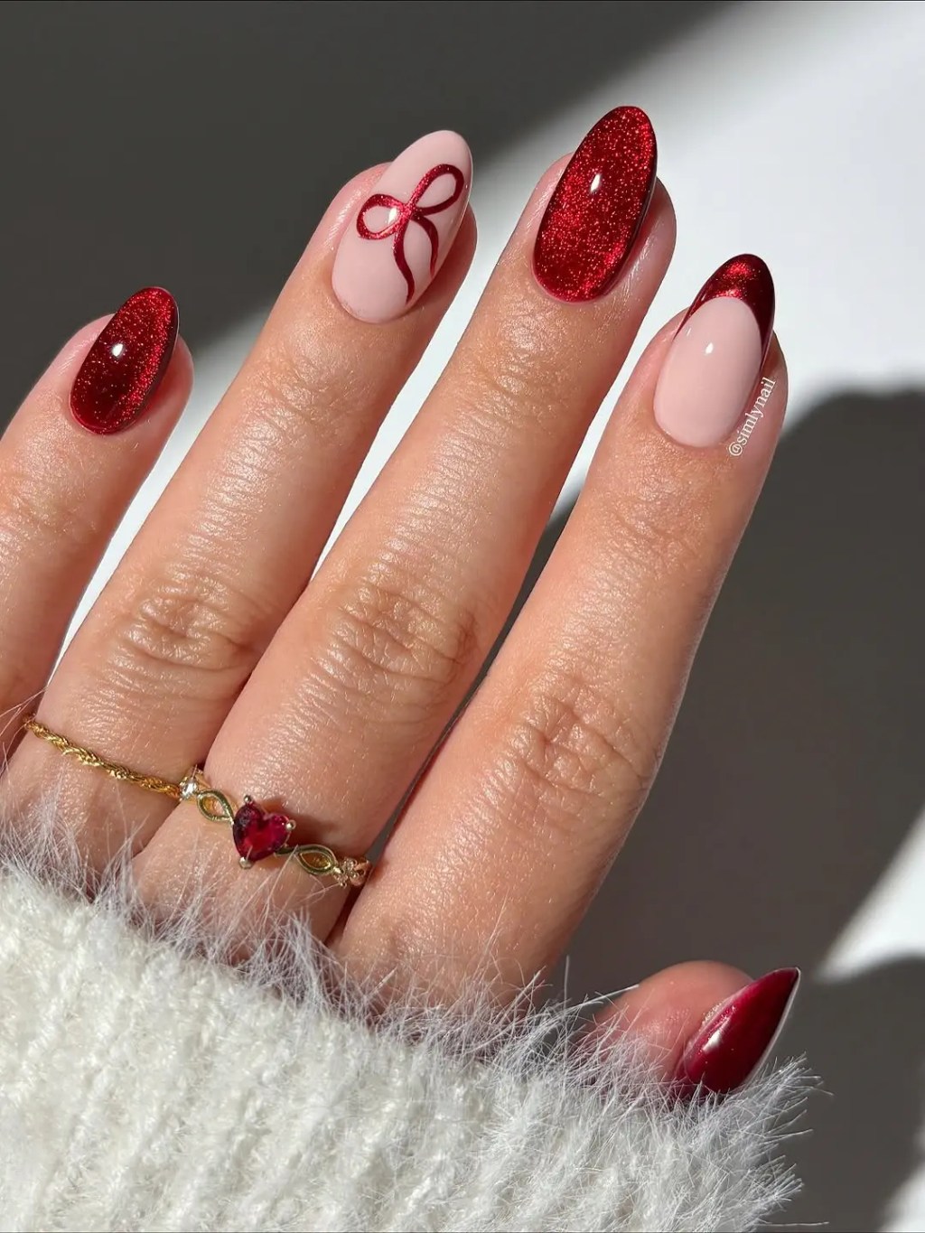 Festive Red Glitter Cat-Eye with Bows — Christmas Gel Nails 2026